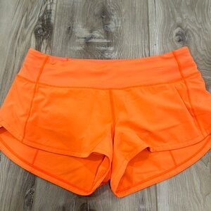 Lululemon speed up low rise 2.5 shorts size 4 neon orange